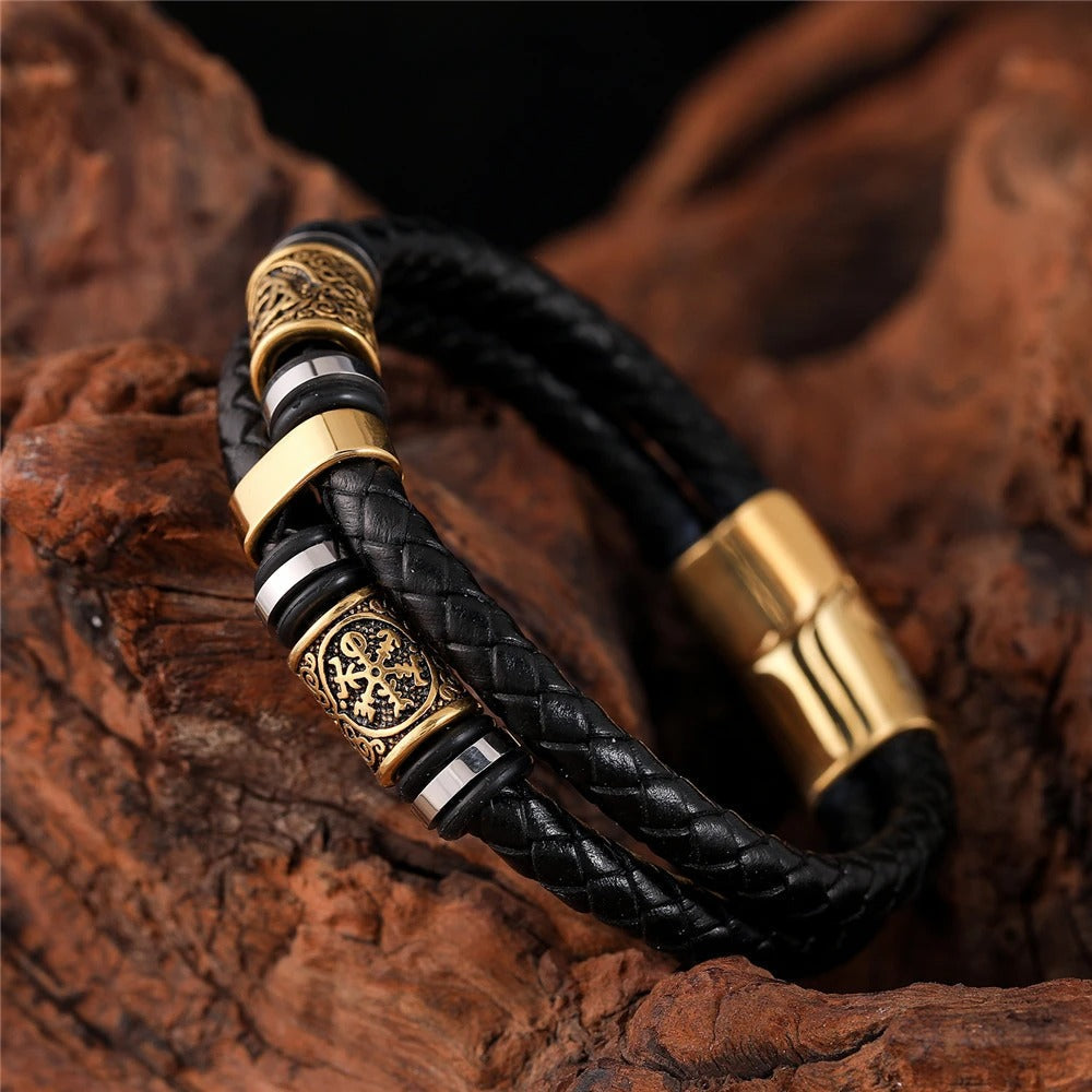 Sort flettet læderarmbånd med guldfarvet vedhæng